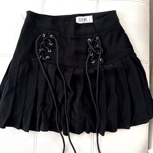 Black Pleated Skirt with Lace-Up Detail